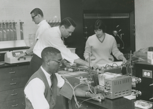 Nancy Turpin and Joe Jonston with Don Hall in physics class, 1967.